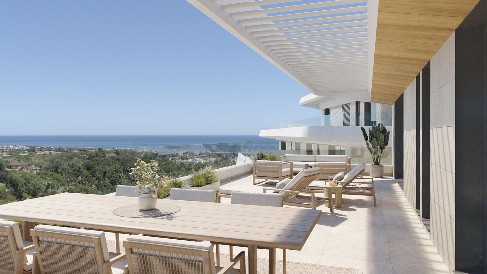 Terraza de lujo con vista al mar, incluye mesa de comedor y sillones.